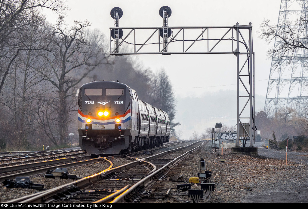 Dual-mode AMTK 708 leads Amtrak Empire Service Train 281 approaching the Hudson, NY station stop.